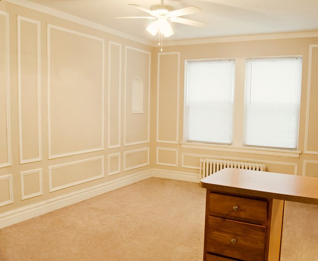a dining room with white walls and a table